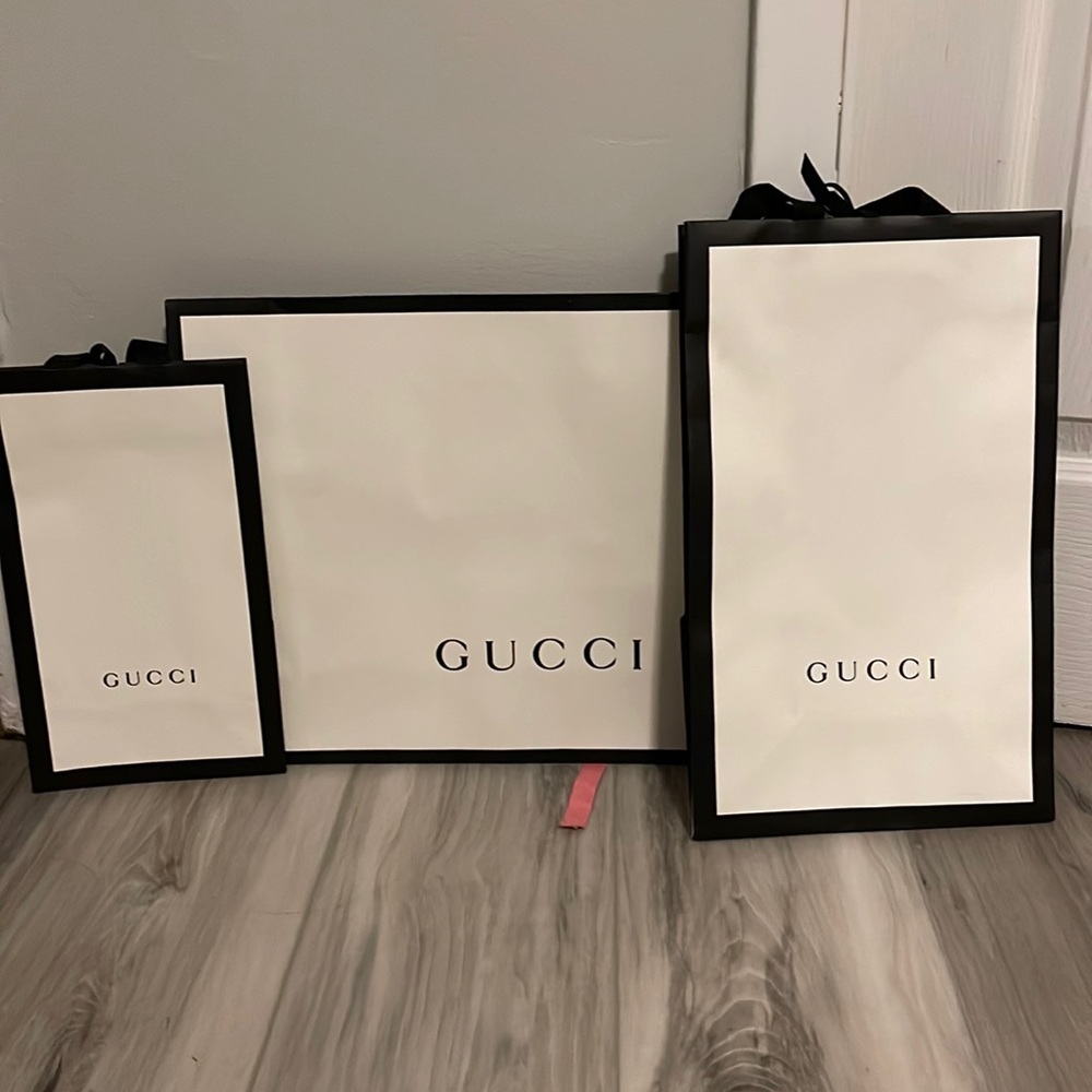 3 Gucci shopping bags